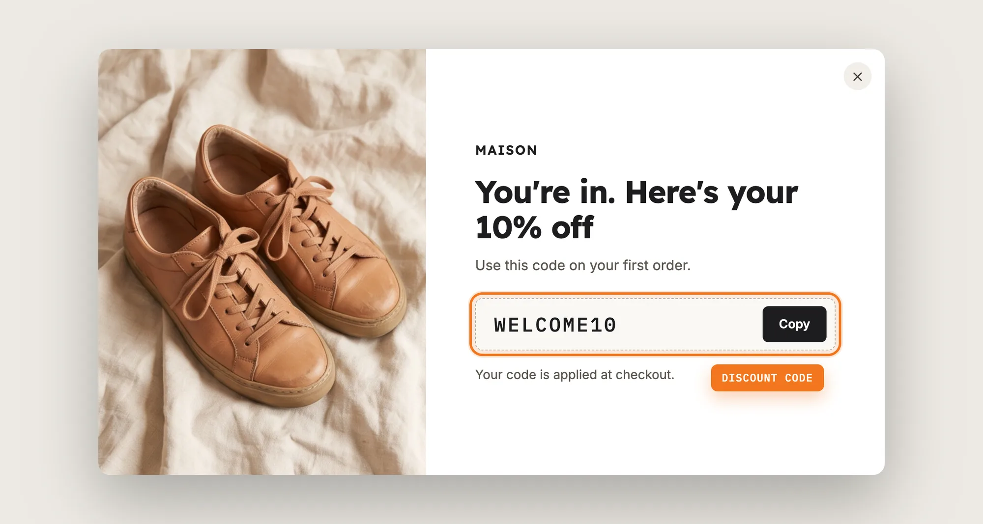 A newsletter pop up success screen with the WELCOME10 discount code and a Copy button highlighted