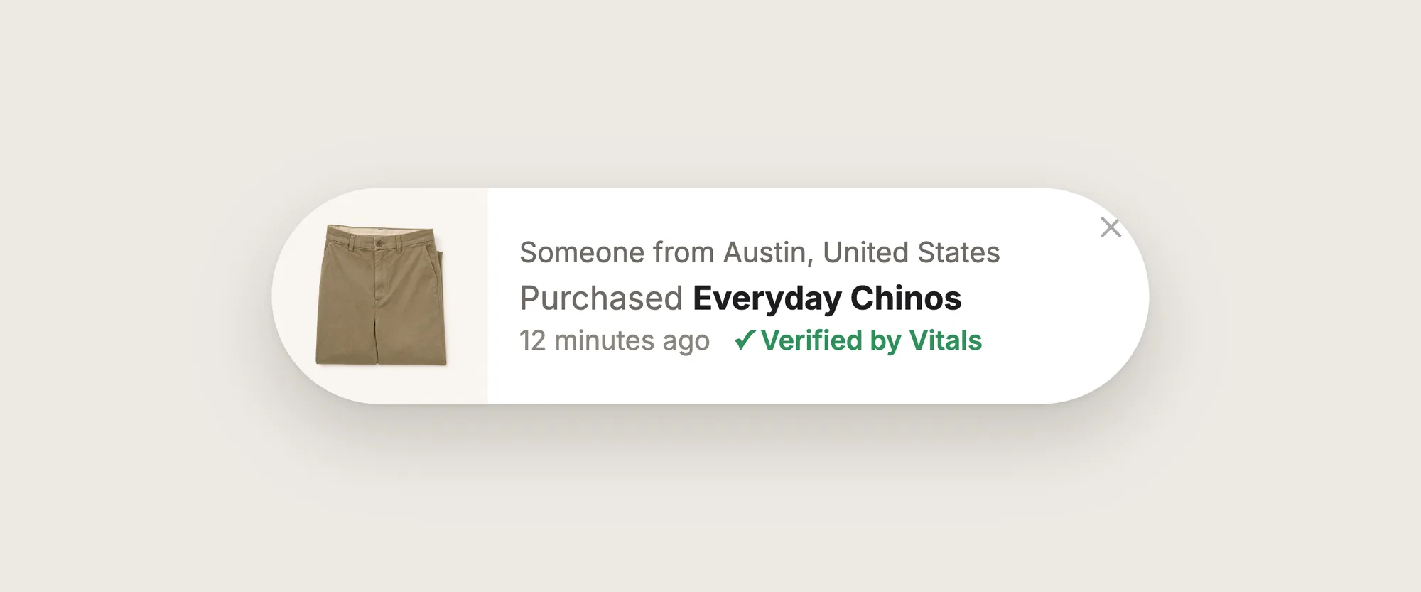 Close-up of a sales pop-up: "Someone from Austin, United States, Purchased Everyday Chinos, 12 minutes ago" with a product photo and a Verified by Vitals check