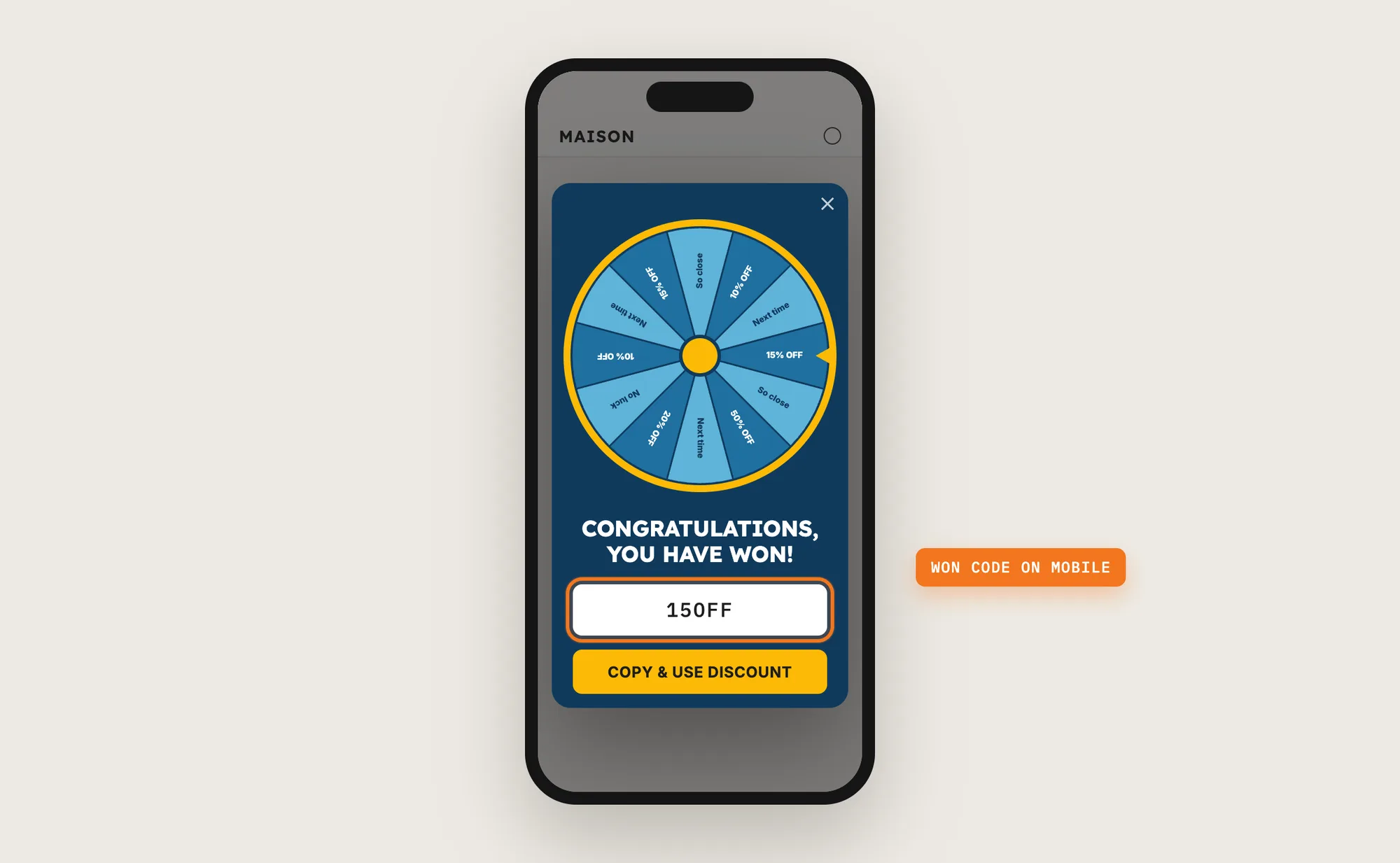A phone showing the spin the wheel pop-up after a win, with the 15OFF code highlighted and a Copy and use discount button